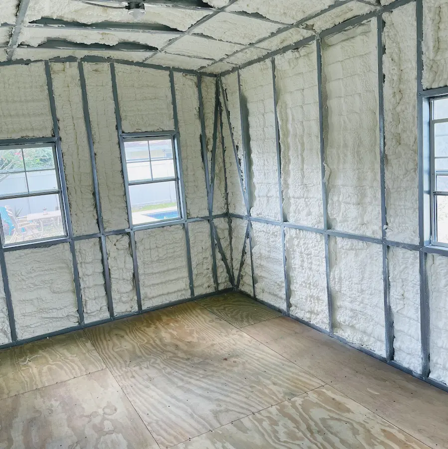 Closed-cell spray foam insulation applied to wall cavities in a residential project in Hooper